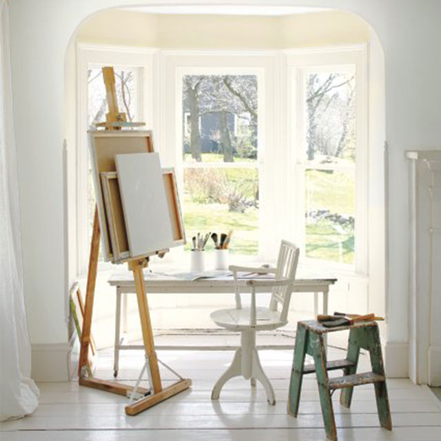 Sunny corner alcove with painting easel.