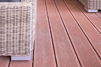 Wood deck with wicker furniture