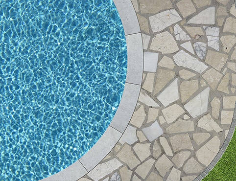 Inground swimming pool with stone decking