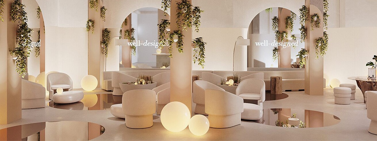 This beautiful, lounge-like Well-Designed space features walls painted in a gentle pink, Love & Happiness 1191, hanging plants, relaxing seating, soft glowing lamps, and accent floor mirrors.