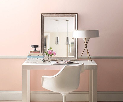 White desk along pink accent wall