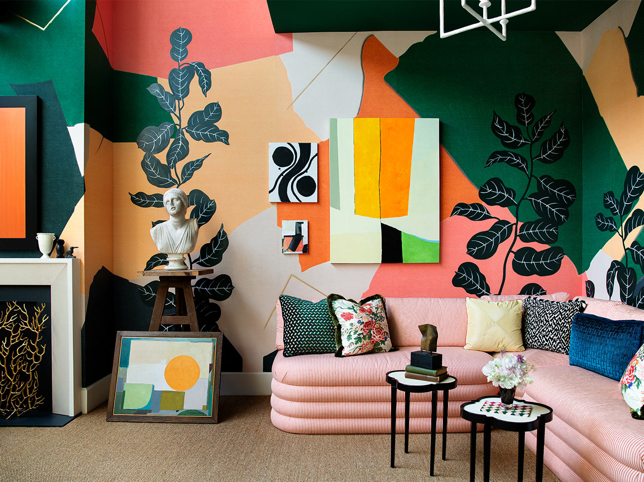 Young Huh's Kips Bay Decorator Show House 2019: Sitting room with pink couch and multi-colored abstract walls painted in a range of Benjamin Moore colors.