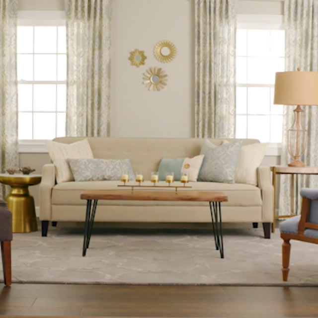 Well-lit living room with neutral decor.