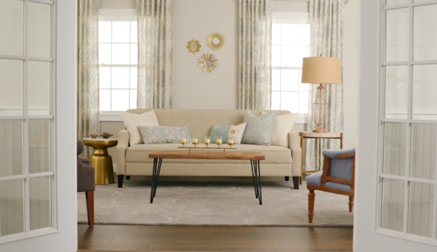 Well-lit living room with neutral decor.