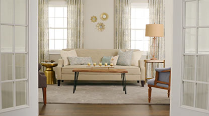 Well-lit living room with neutral decor.